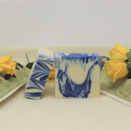 By the Sea Soap Shoppe bar of soap called "Refreshing Lemongrass. White bar with blue swirls. Vegan, all-natural ingredients with Lemongrass Essential Oil and Castor Oil for extra moisturizing. $7.00