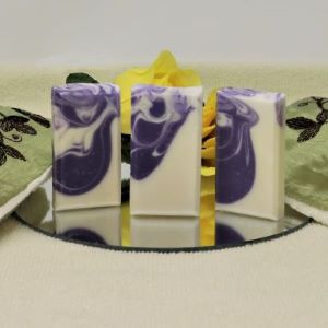 Luscious Lavender mini soap bars made by "By the Sea Soap Shoppe". Three bars, white with swirls of purple scented with Lavender Essential oil. Size is two and a half inches high, one and a quarter inches wide and half an inch deep. Vegan, all natural ingredients, $3.00 each.