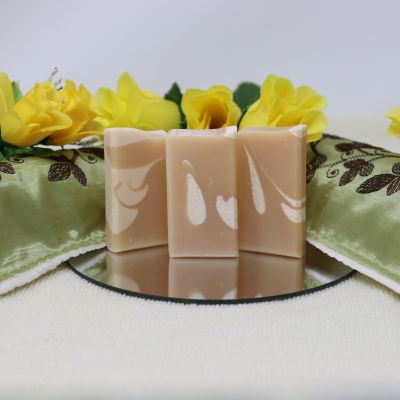 By the Sea Soap Shoppe "Great Goat mini soap" is a travel size bar made with goat milk instead of water. The bar is light brown with off white swirls. It is pleasantly scented with a "Honey, Milk and Oatmeal" fragrance. Natural ingredients, good for your skin, moisturizing. $3.00 each.