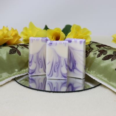 Our By the Sea "Luscious Lavender" mini soap is the perfect size for travelling. The soap is white with swirls of purple and scented with Lavender Essential oil. Moisturizing, all-natural ingredients, vegan. Handmade in Prince Edward Island, Canada. $3.00 each.