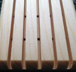 Light brown wooden soap saver made of white pine. It has five slats as well as holes for drainage.  Made of white pine, it is durable and stands up to water. $5.00 each.