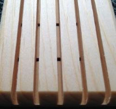 Light brown wooden soap saver made of white pine. It has five slats as well as holes for drainage.  Made of white pine, it is durable and stands up to water. $5.00 each.